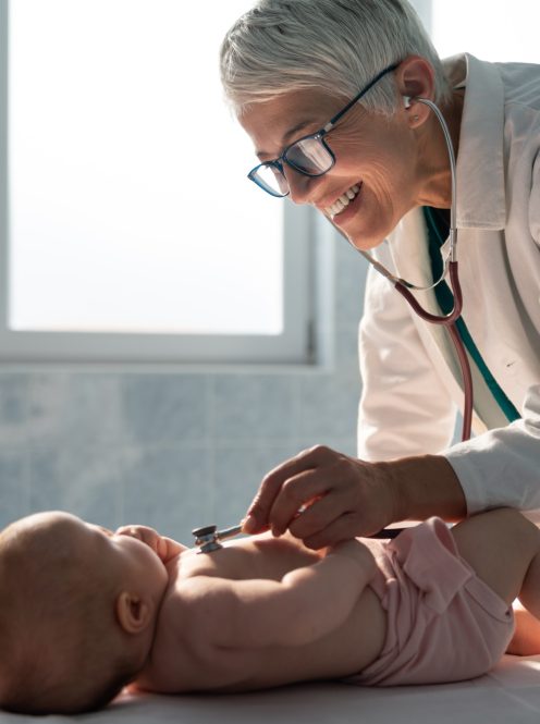 Pediatric doctor exams little baby. Health care, medical examination, people concept